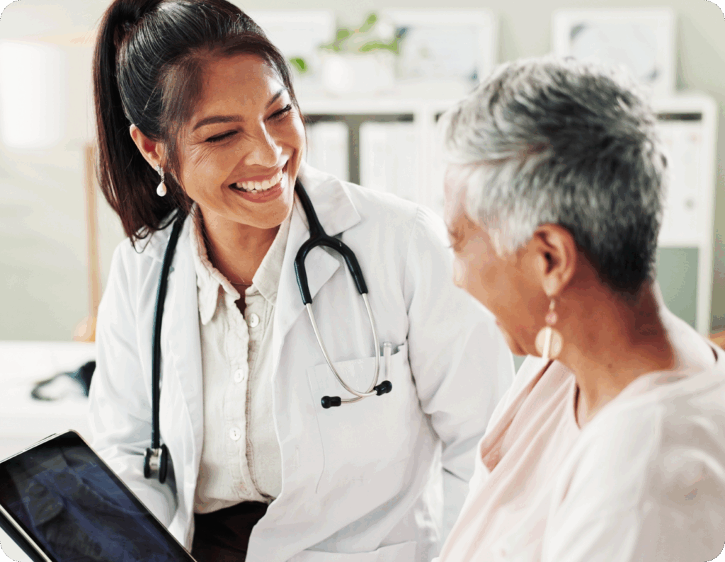 alt="Healthcare provider consulting patient about remote monitoring options"