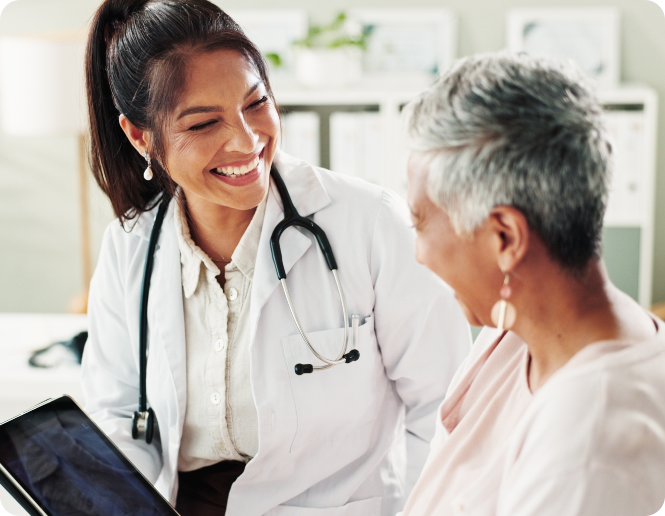 alt="Healthcare provider consulting patient about remote monitoring options"