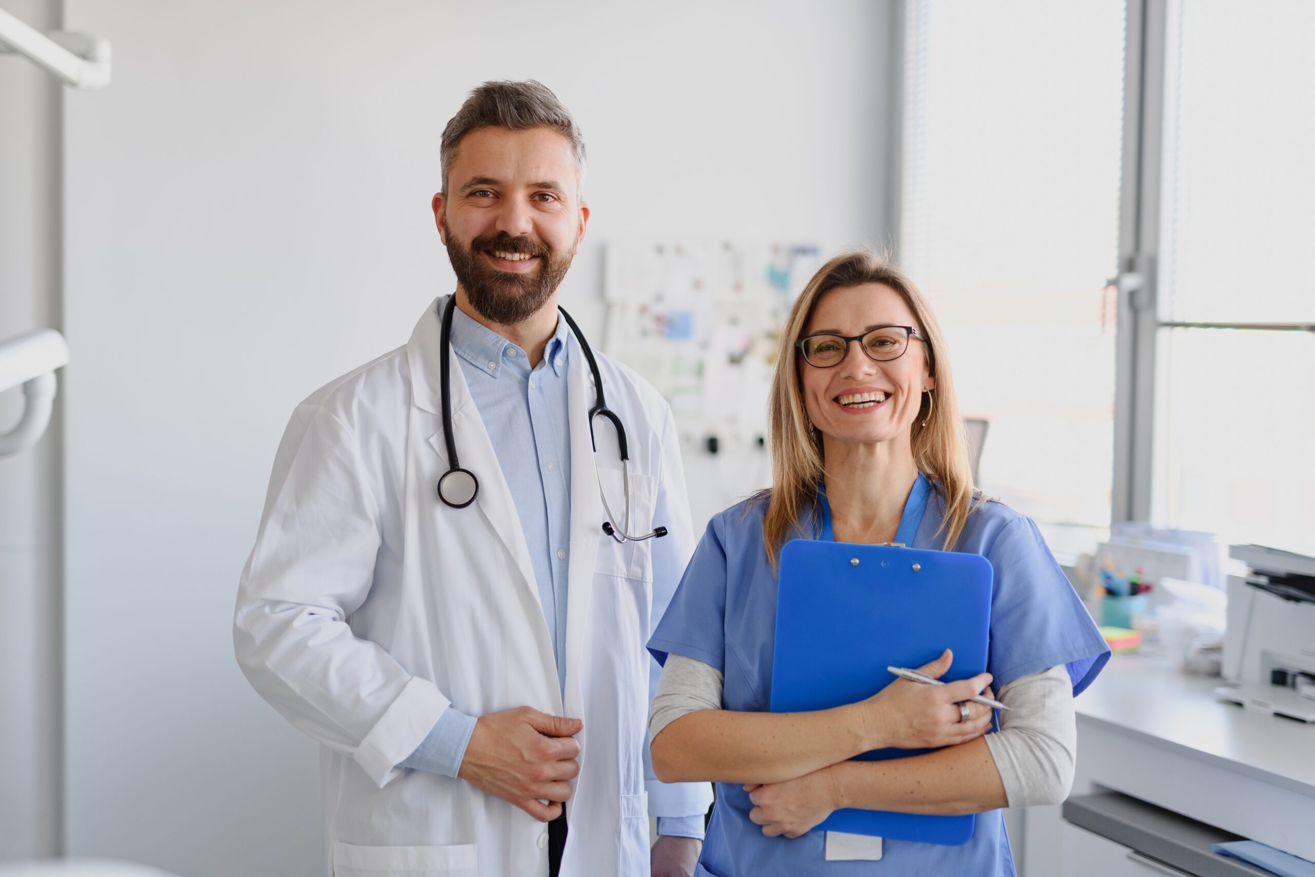 doctor and nurse smiling